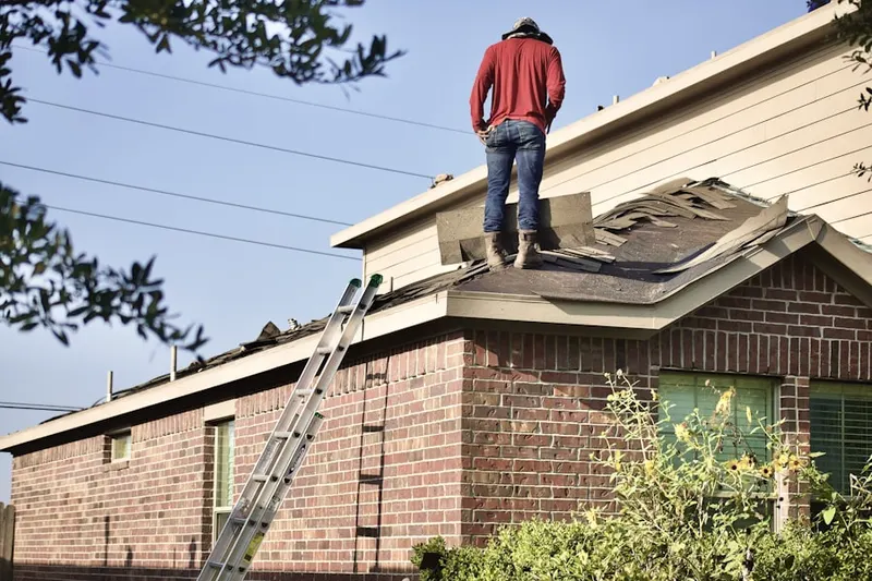Professional roofer working on a residential roof in Sossaman Estates